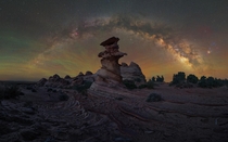 A shot of the Milky Way and formations of the Vermillion Cliffs in the UtahArizona border 