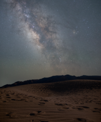 A sky full of stars over the Mesquite Flat Sand Dunes in Death Valley National Park 