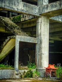 A small shrine at an abandoned construction site in Malaysia 