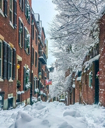 A snowy scene on Acorn Street in Boston MA 