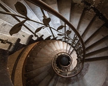 A spiral staircase in an abandoned hotel 