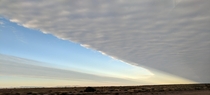 A split sky over the desert