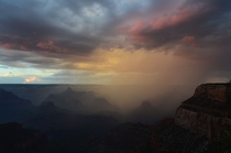 A storm passing through the Grand Canyon at sunset 