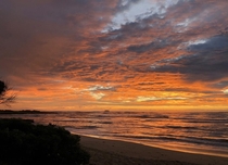 A stunning sunset on a sandy beach in Hawaii USA 