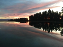 A sunset I caught in New Zealand over a glass lake 