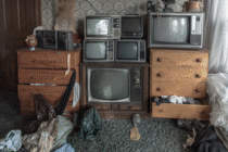 A wall of old televisions found in the bedroom of an old abandoned house in Ontario Canada oc   