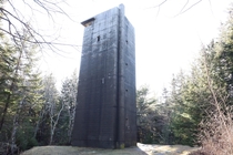 A World War  gun tower in the woods of Maine