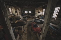Abandoned automobiles inside old Munnsville Elementary School in Upstate New York The gym had been used as a Hot Rod Shop Photo by urban explorer Bryant Neal