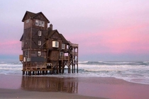 Abandoned beach house in the Outer Banks North Carolina slowly being reclaimed by the sea X