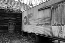 Abandoned beer truck holding up an abandoned house near Morton Washington 