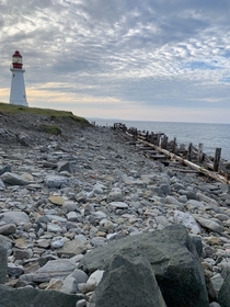 Abandoned boardwalk next to a not abandoned lighthouse