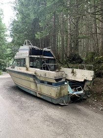 Abandoned boat in the middle of a forest in Washington