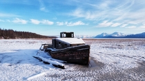 Abandoned boat on the frozen mudflats in Palmer Alaska