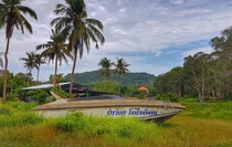 Abandoned boat on tropical island