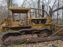 Abandoned bulldozer in the woods