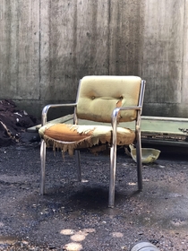 Abandoned construction company This chair was sat in the middle of a sun beam peaking through the collapsed warehouse roof Image is point and shoot unedited natural lighting