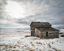 Abandoned Farmhouse found in the prairies on a cold winter day OC