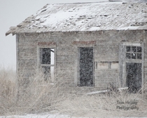 Abandoned farmhouse in a rare heavy snowstorm Anton Texas