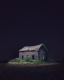 Abandoned farmhouse under the stars