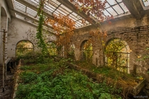 Abandoned greenhouse in autumn 