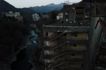 Abandoned hotels perched upon a river