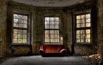Abandoned house with a couch inside for some romance