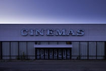 Abandoned movie theater at dusk Insta brick_grunge