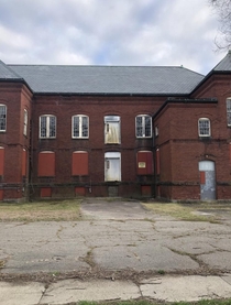 Abandoned Places Massachusetts - abandoned mental hospital in Medfield ive been to but if anyone else has been here lmk the way in because all ground level windows are covered with these red boards