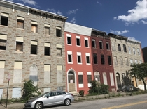 Abandoned rowhouses near Baltimores Harlem Park Only one mile west of the bustling city center