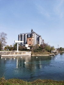 Abandoned silos on the river port Silea Veneto Italy