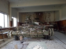 Abandoned tank in working military unit