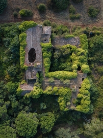 Abandoned th-century Portuguese monastery enclosed by green wilderness 