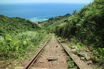 Abandoned tracks that lead towards the sea
