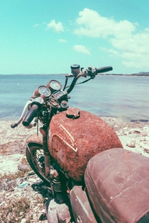 Abandoned vintage honda cb bike left by the sea