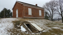 Abbe Creek School - first school in Linn County Iowa Named after the first European settler in the area Detached basement is arched brick no access to or from school In the back ground is the entry to Abbe Creek cemetery Some of the folks buried there wer