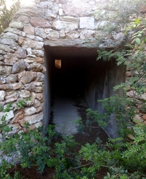 Access tunnel leading into an abandoned half-constructed mansion 
