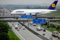 Airbus A crossing the Autobahn at Leipzig airport 