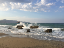 Amazing view of waves crashing onto rocks in Crete Greece 