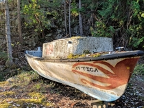 An abandoned boat on an island in BC Canada 