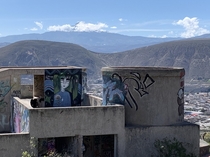 An abandoned building in the north of Quito Ecuador directly above Mitad del Mundo and very close to the Equator In the distance is the snow-covered Cayambe volcano