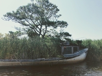 An abandoned fishing boat being claimed by the marsh near Corolla NC