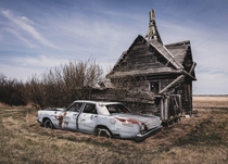 An abandoned  Grist Mill and a  Ford Galaxie on the Alberta Prairie