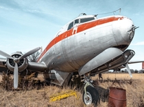 An abandoned plane in a field OC