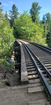 An abandoned railroad bridge in the middle of the woods