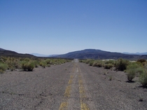An abandoned section of US  in western Nevada with early s striping still intact  x