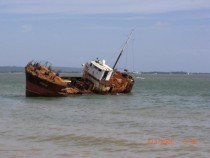An abandoned ship near Black River Jamaica 
This picture was taken in  Our last trip in  the ship had been scrapped but the skeleton still remained 