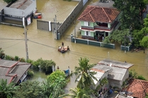 An aerial view shows people making their way through a flooded area in the suburbs of Colombo Sri Lanka on June   Photo by Sri Lanka Air Force MediaHandout via Reuters