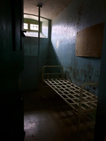 An empty cell in an abandoned prison OC 