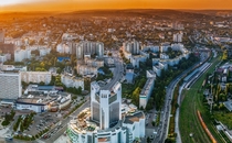 An Isengard-esque shopping center rising among Soviet-era apartment blocks near downtown Chiinu Moldova 