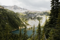 An island in a glacial lake surrounded by the North Cascades 